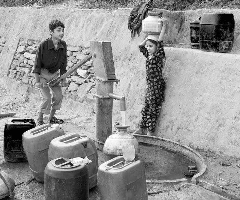 Children and Water - Procuring water from a roadside handpump in Tehri district, Uttarakhand